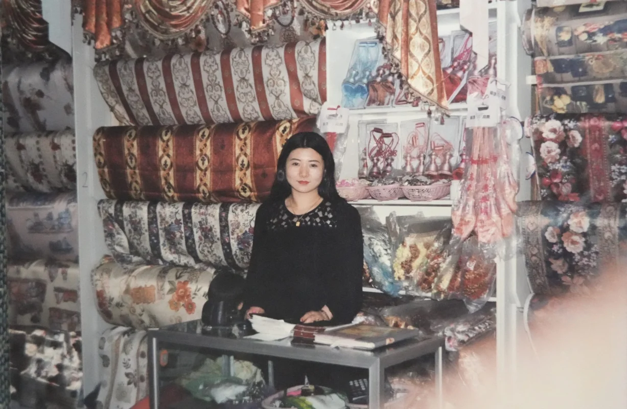 Lemonhone showroom display with curtains and staff member