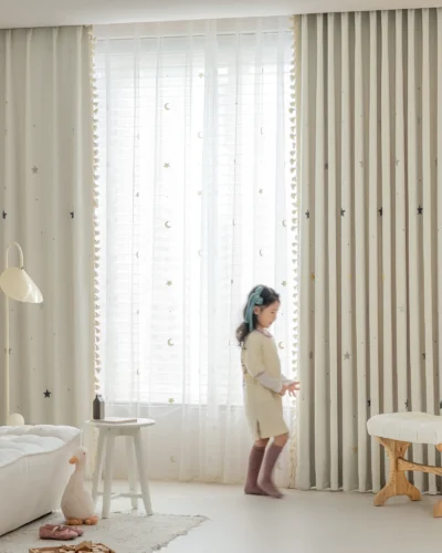 Full view of Starry Weave Curtain installed in a child’s room with embroidered star design and light-filtering fabric