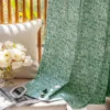Textured green jacquard curtain with pleats, ideal for Japandi interiors