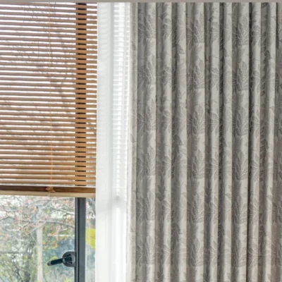 Botanic jacquard curtain in close-up, showing soft leaf pattern and light-filtering texture