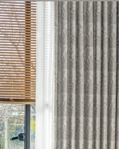 Botanic jacquard curtain in close-up, showing soft leaf pattern and light-filtering texture