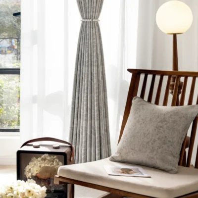 Botanic jacquard curtain styled in modern interior with natural light and wooden furniture