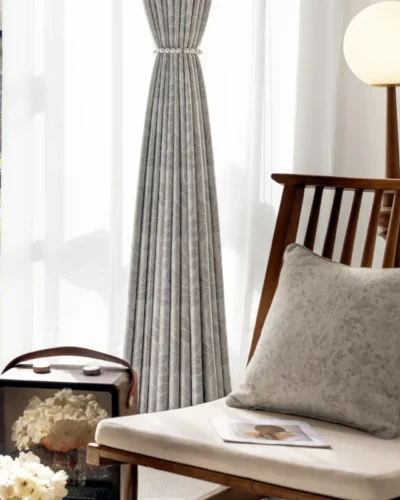 Botanic jacquard curtain styled in modern interior with natural light and wooden furniture