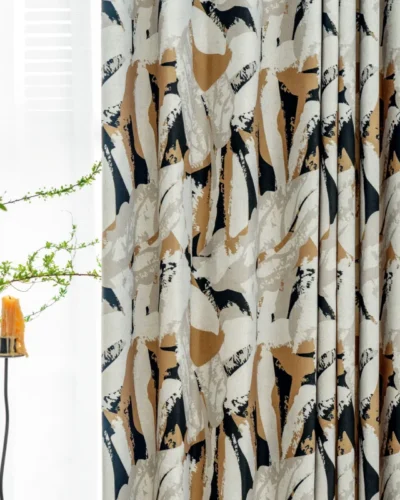 Painter’s Bloom curtain fabric close-up with abstract floral print and candle decor.