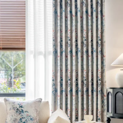 Dreamy Meadow watercolor floral curtains hanging by a window, softly filtering natural light into a serene living space