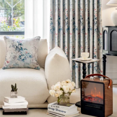 Watercolor floral curtain in living room – soft blue and blush drapes from Dreamy Meadow collection, styled with neutral sofa and flowers.