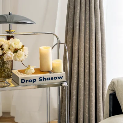 High-density gilded texture curtain in beige color, softly glowing in daylight with elegant folds.