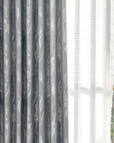 Close-up of grey stone vein jacquard curtain with natural light filtering and elegant pleats