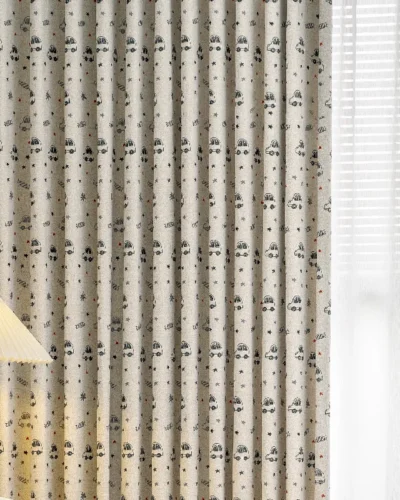 Close-up of cartoon car print curtain fabric with stars in neutral tones