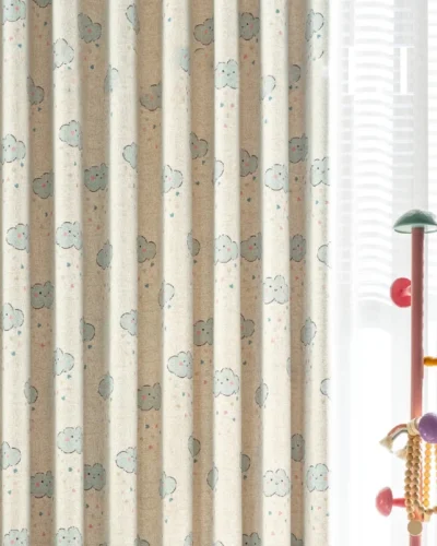 Side view of smiling cloud curtain layered with white sheers in kids room