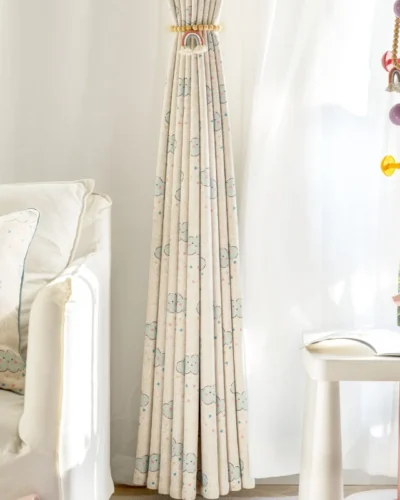 Full-length smiling cloud curtain with tieback and white sheers in kids room