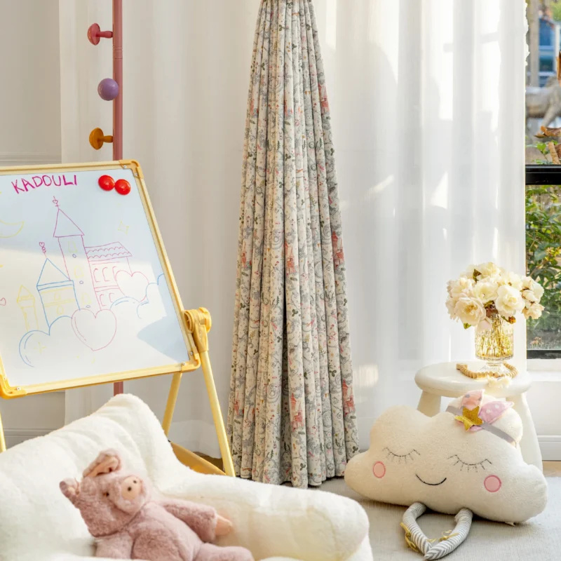 Fairy tale curtain with storybook castle print in a cozy children's room with toys and sunlight