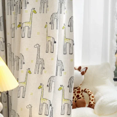 Giraffe print curtain hanging in a child’s room with soft lighting and plush toy