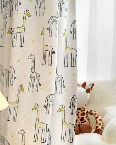 Giraffe print curtain hanging in a child’s room with soft lighting and plush toy