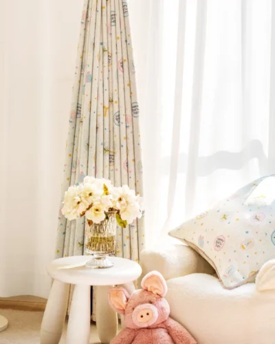 Happy Day Curtain hanging in a bright kids’ room with plush toys and colorful decor