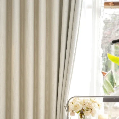 Light beige curtain with subtle texture in modern living room, illuminated by natural light – Ivory Breeze Collection