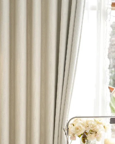 Light beige curtain with subtle texture in modern living room, illuminated by natural light – Ivory Breeze Collection