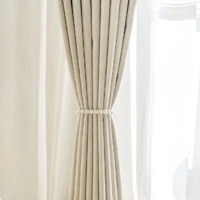 Herringbone texture curtain tied back for soft natural light