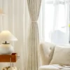 Minimalist herringbone curtain draped over window in serene interior