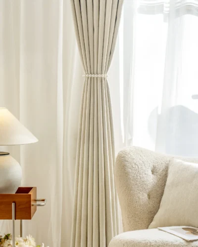 Minimalist herringbone curtain draped over window in serene interior