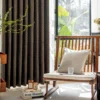 Earthline Curtain in charcoal brown displayed in a modern living space – textured woven drapes gently filtering light with nature-inspired elegance by Lemonhone.