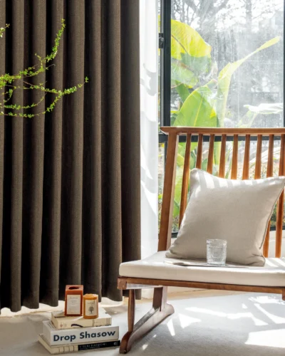 Earthline Curtain in charcoal brown displayed in a modern living space – textured woven drapes gently filtering light with nature-inspired elegance by Lemonhone.