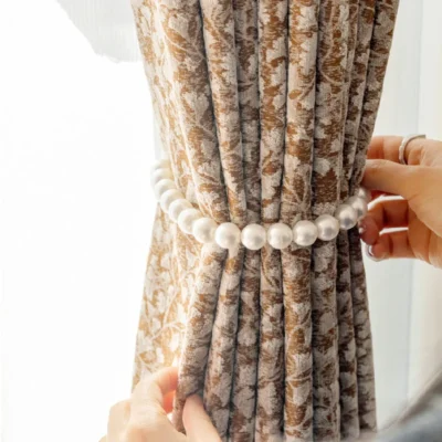 Close-up of Floral Realm jacquard curtain gathered with tieback, showing detailed texture and drape.