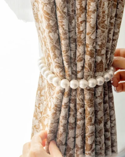 Close-up of Floral Realm jacquard curtain gathered with tieback, showing detailed texture and drape.