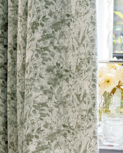 Botanical jacquard curtain hanging by window with soft nature-inspired pattern