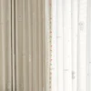 Close-up of Friendly Pup Curtain – beige jacquard and white sheer layers with dog embroidery and colorful trim