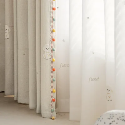 Side view of Friendly Pup Curtain – layered jacquard and sheer dog motif curtains with colorful trim