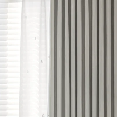Blush Sweet Curtain in dark grey jacquard stripes, softly filtering light in a neutral kids’ or nursery room