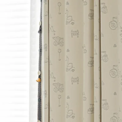 Side view of Playful Construction Kids Curtain with jacquard truck motifs
