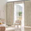 Children's room curtain with embroidered yellow planets and sheer white layers, ideal for playful and cozy spaces