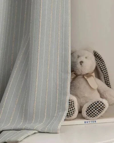 Minimal striped curtain in mist grey with soft vertical lines, ideal for cozy kids’ spaces