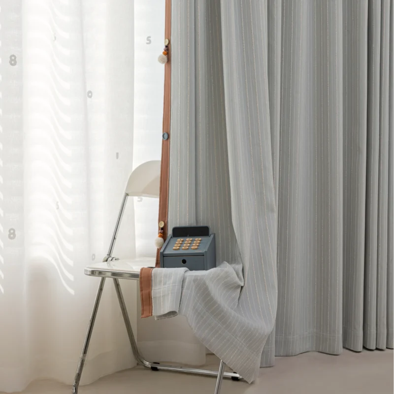Minimal striped curtain in mist grey with soft vertical lines, ideal for cozy kids’ spaces
