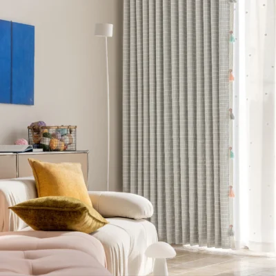 Whisper Glow Curtain with British plaid jacquard design in a cozy corner with sofa and wall art