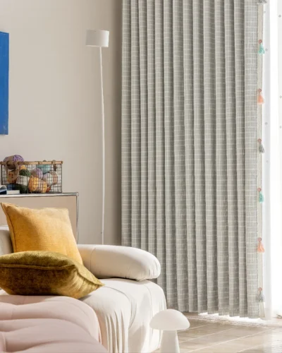 Whisper Glow Curtain with British plaid jacquard design in a cozy corner with sofa and wall art