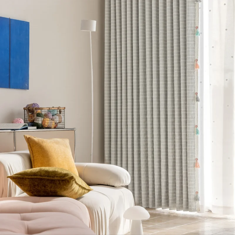 Whisper Glow Curtain with British plaid jacquard design in a cozy corner with sofa and wall art