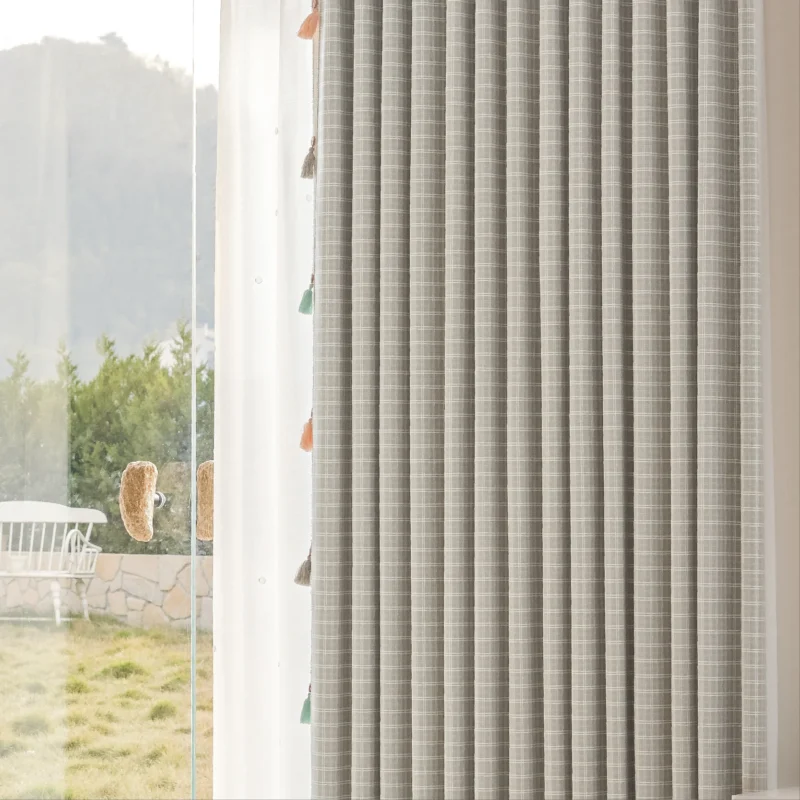Side view of Whisper Glow Curtain showing plaid jacquard texture and soft daylight filtering near the window