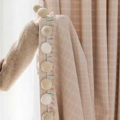 Close-up of Gridline Whisper Curtain showing woven grid texture and hook-style hanging