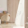 Gridline Whisper Curtain displayed in a modern interior with soft woven texture and subtle check pattern