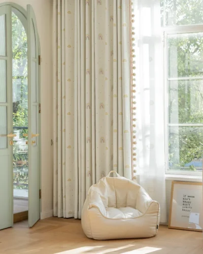Sky Rainbow Curtain hanging in a kids' room with playful rainbow design