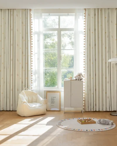 White jacquard curtains with soft light filtering, installed in a modern living room with natural daylight.