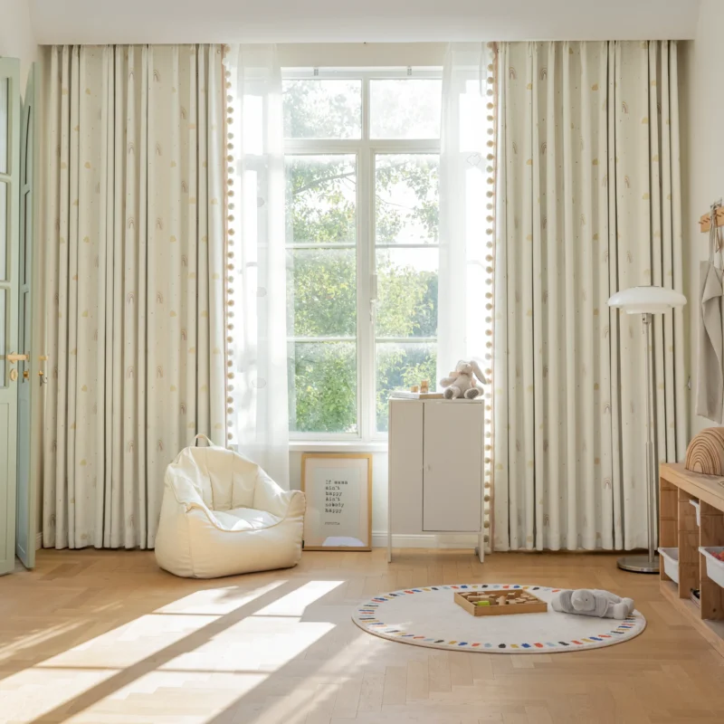 White jacquard curtains with soft light filtering, installed in a modern living room with natural daylight.