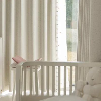Sky Glaze Curtain installed in a baby nursery with soft jacquard fabric and natural light