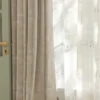 Forest dream curtain layered with sheer white curtain – green animal jacquard fabric softly filtering light in a kids’ room