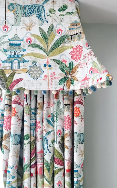 Botanical curtain paired with Eden Pom Tassel Trim – tropical print drapery with colorful accents