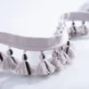 Main product image of single-layer gray tassel fringe trim with hand-tied details and soft matte texture