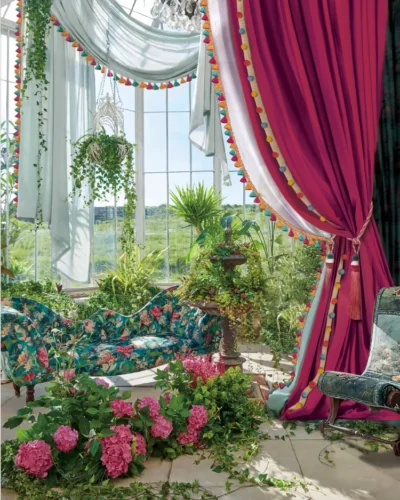 Wine red curtain with tieback styled beside a floral conservatory window – romantic garden view
